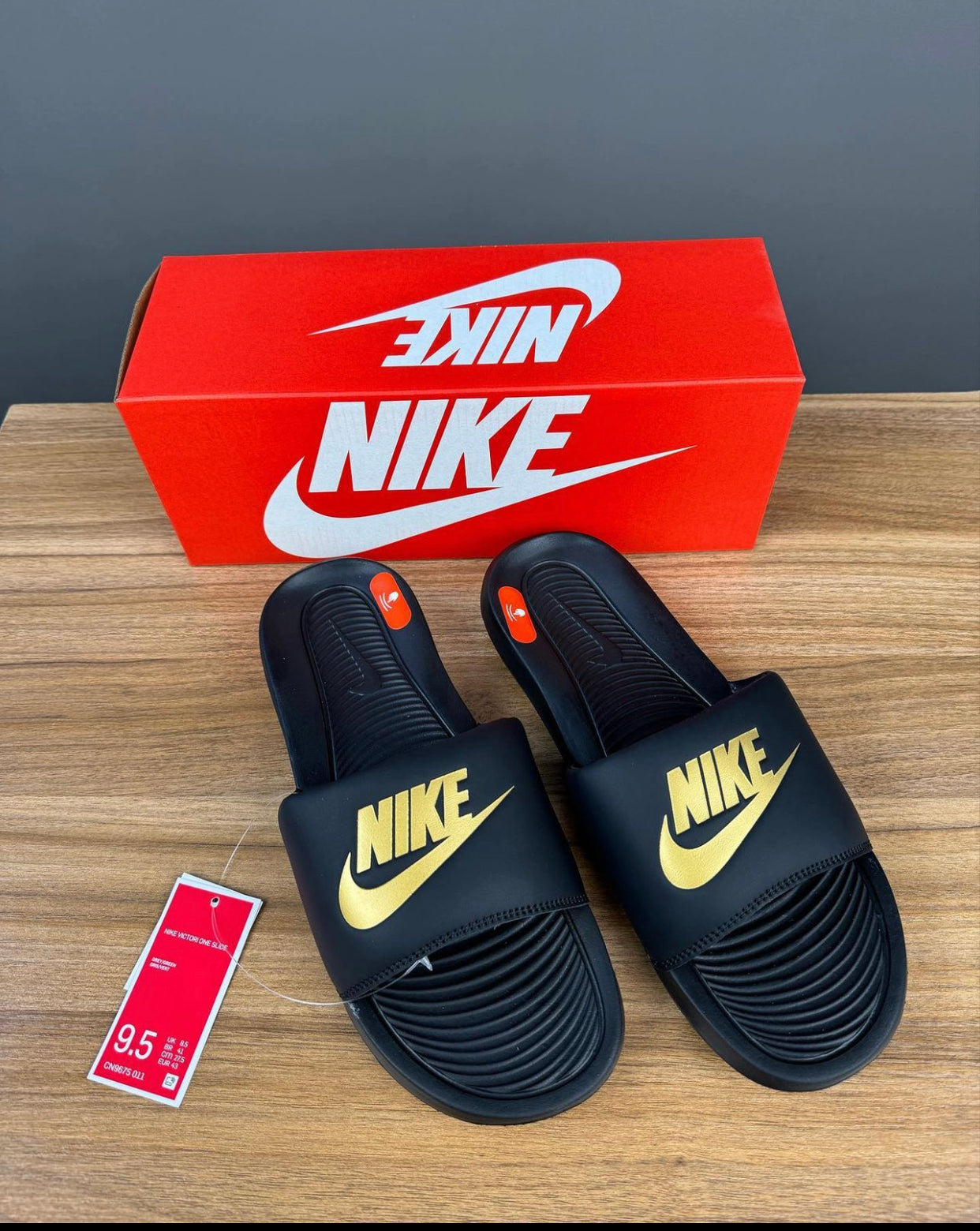Nike victori one slider in black and gold
