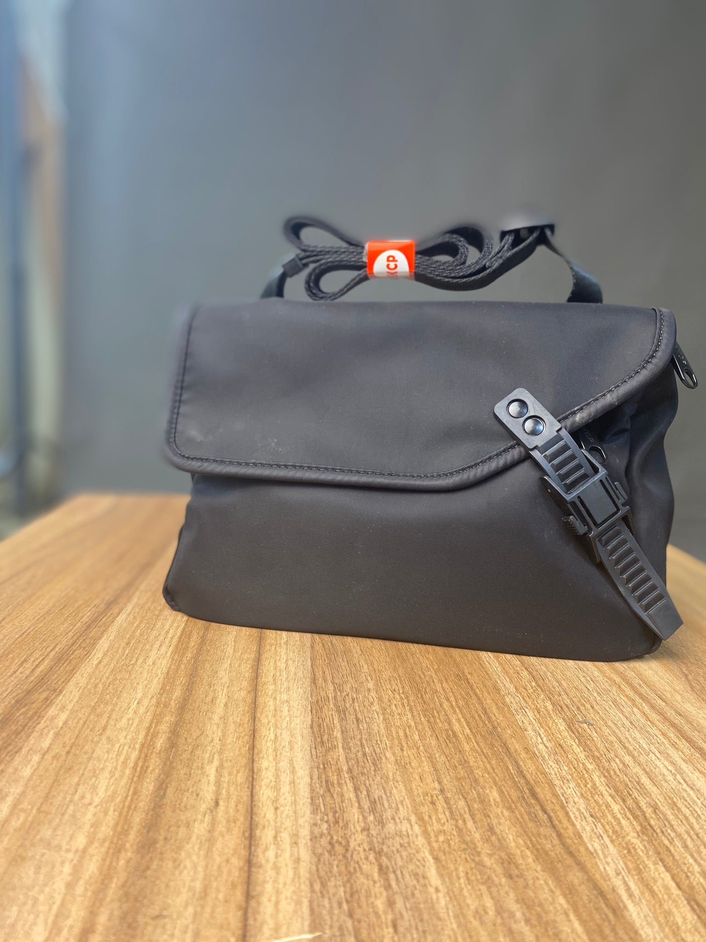 Bkcp cross body bag in both colours. In black