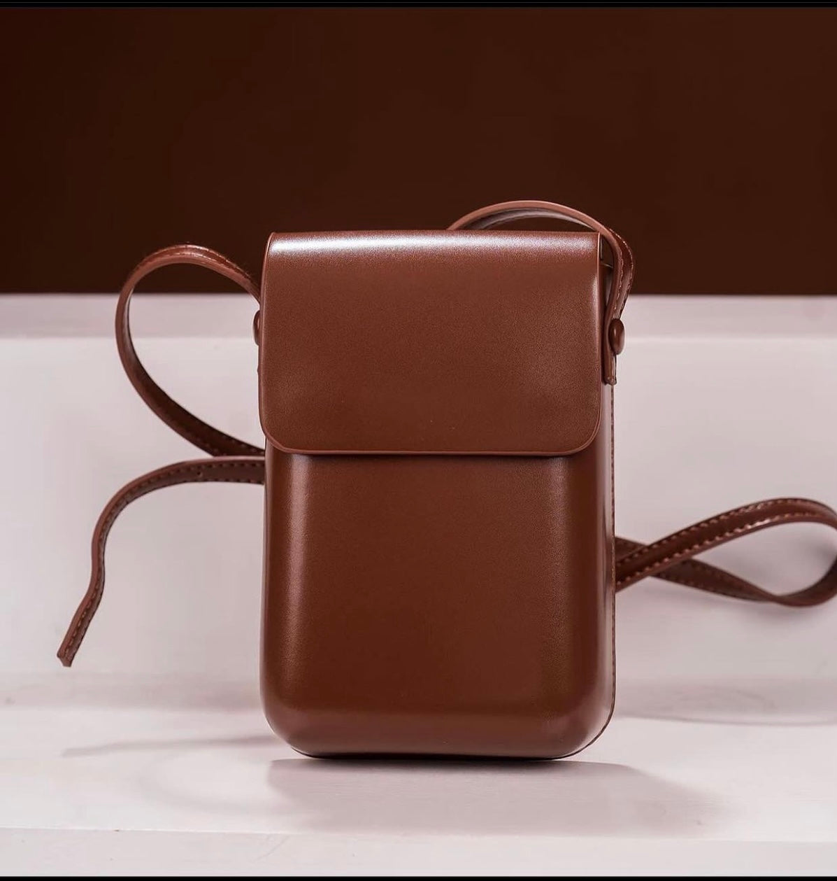 Minimalist flap crossbody bag in brown