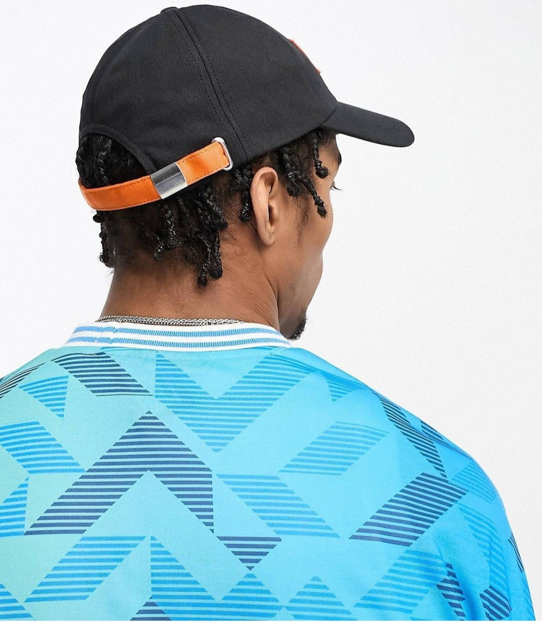 Soft baseball cap with orange logo in black