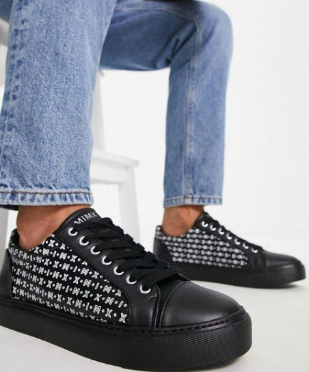 Black trainers with monogram print