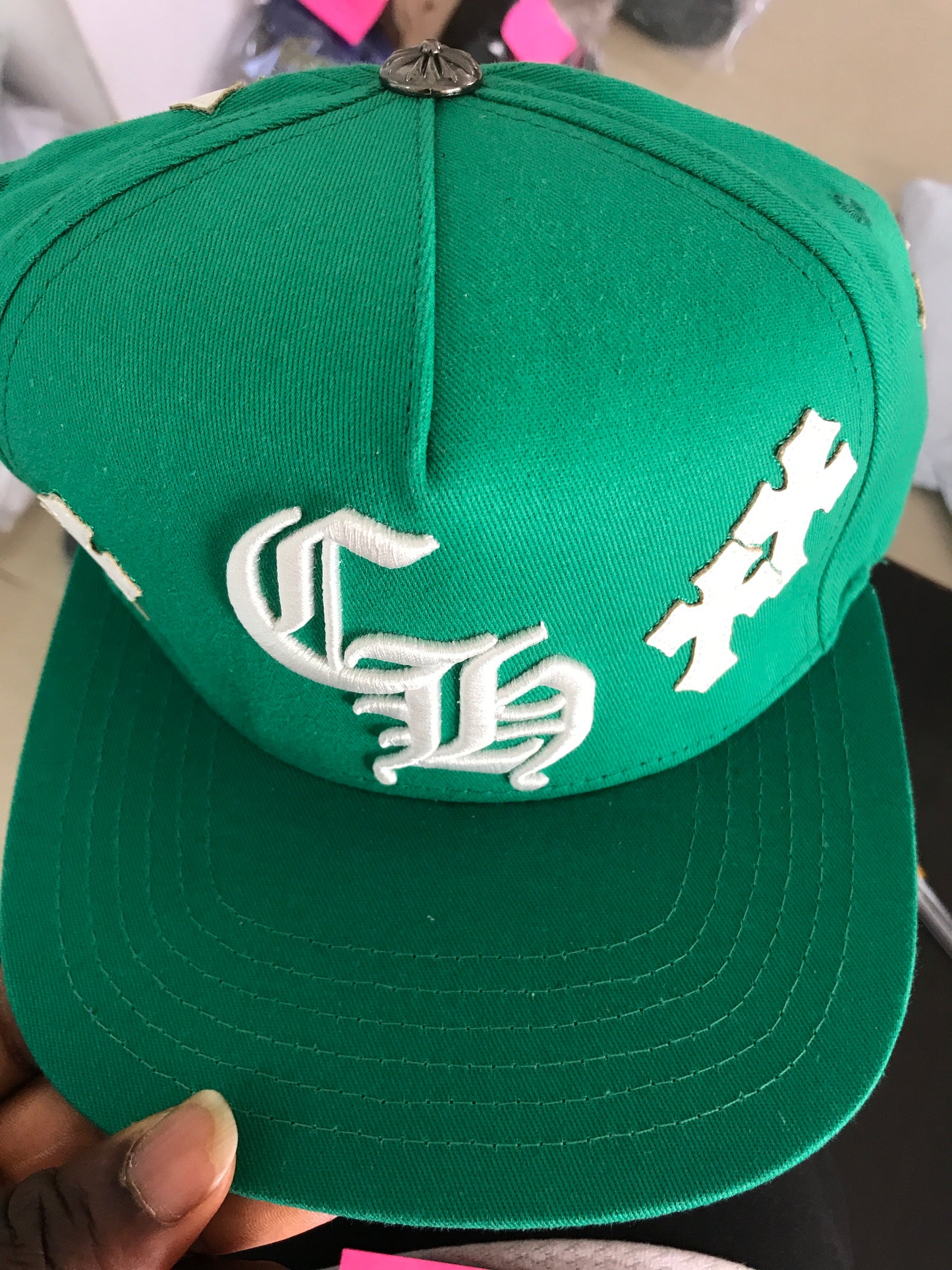 Chrome of heart hats in green