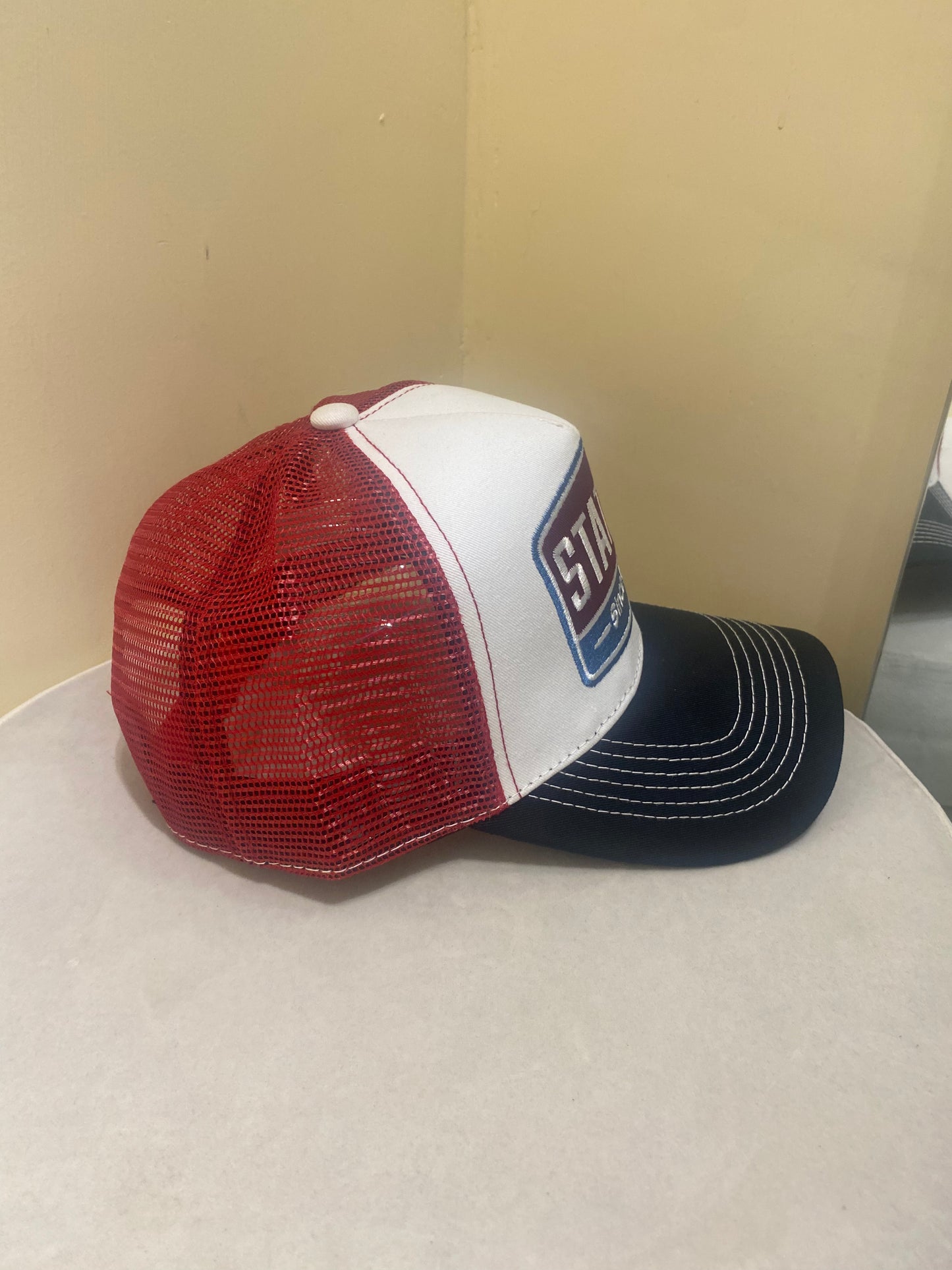 STATION TRUCKER HAT IN RED AND BLACK
