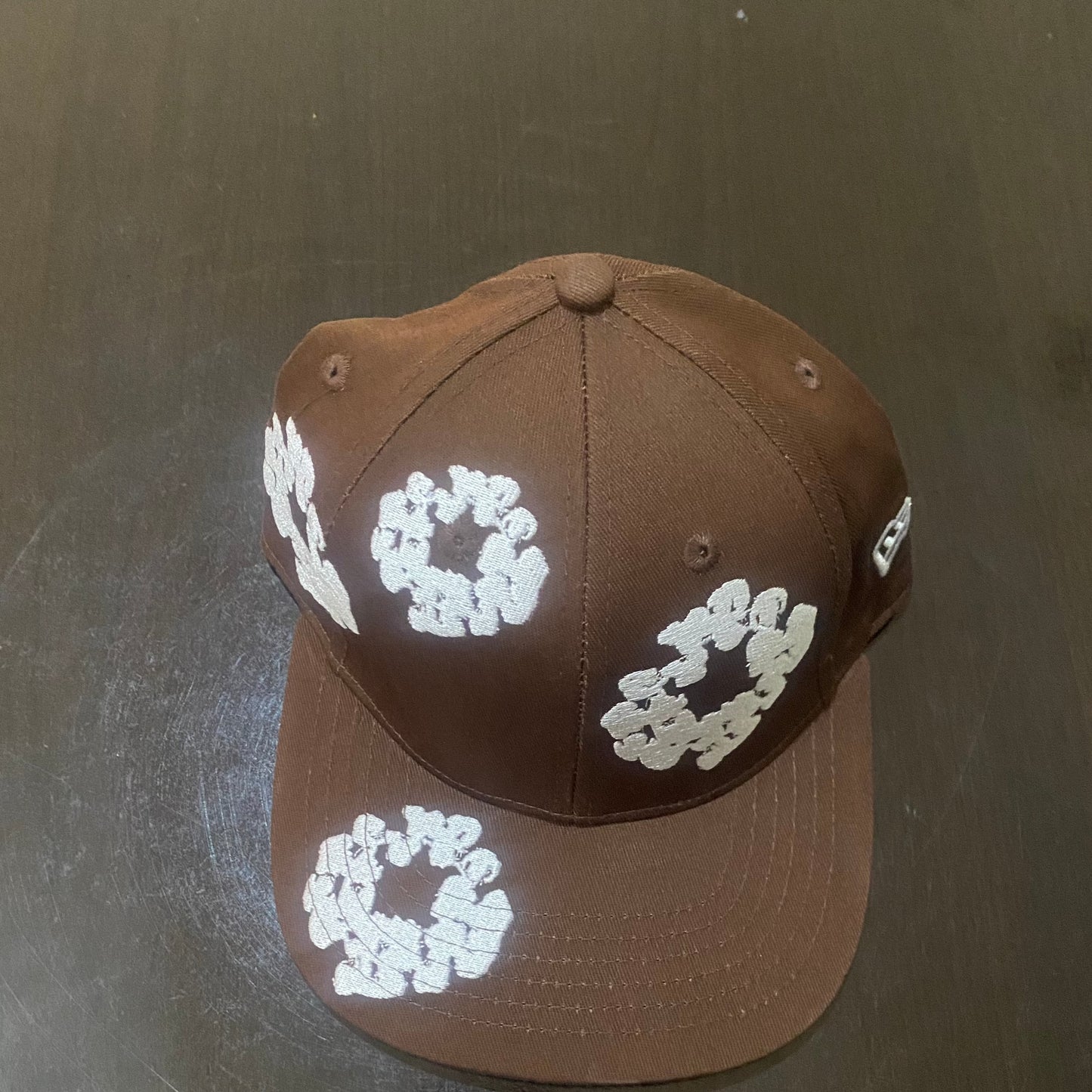 Brown fitted hat