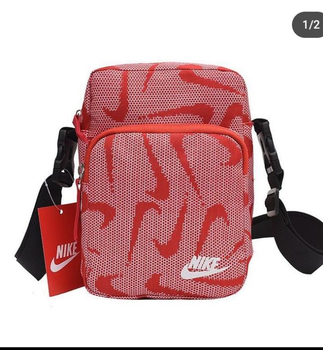 Nike all over print body bag in red