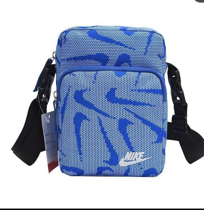 Nike all over print cross body bag in blue