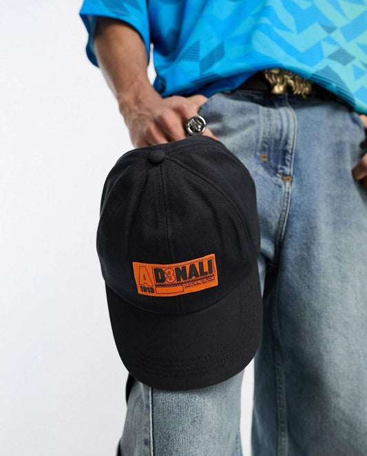 Soft baseball cap with orange logo in black