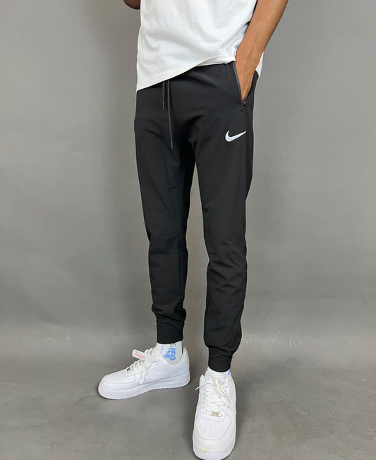 Nike reflective logo jogger pants in black