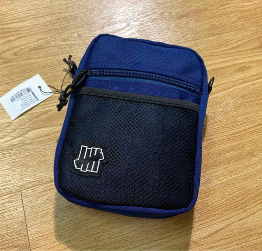 Undefeated cross body bag in blue